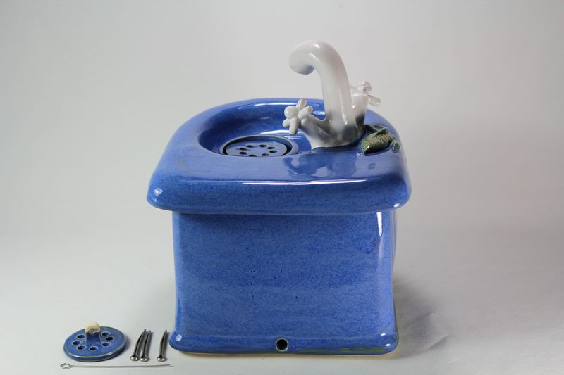 Small cordless pet fountain with faucet spout and internal battery